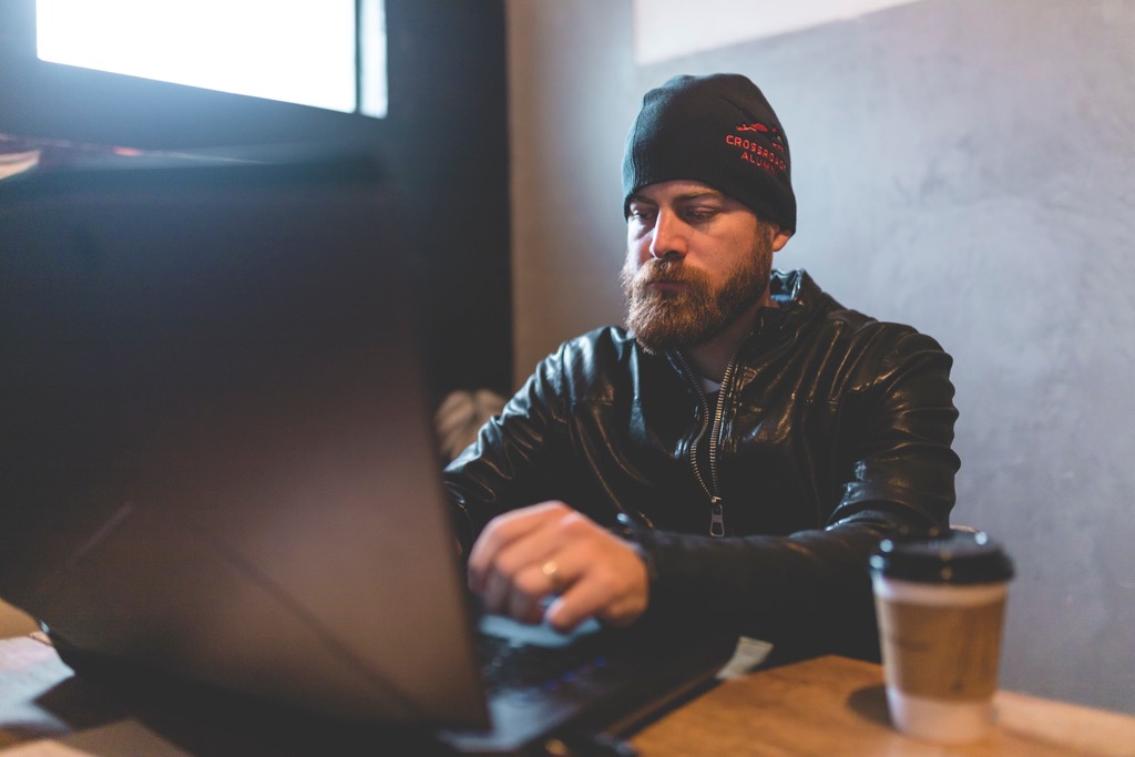 John Crestani working on laptop